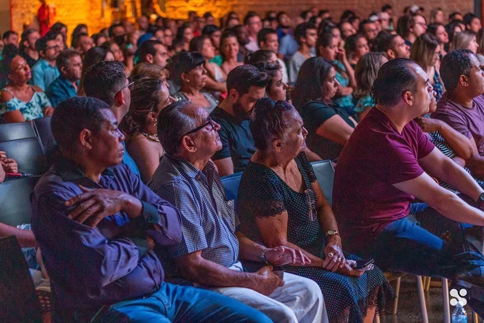 A full room seated and listening during a service