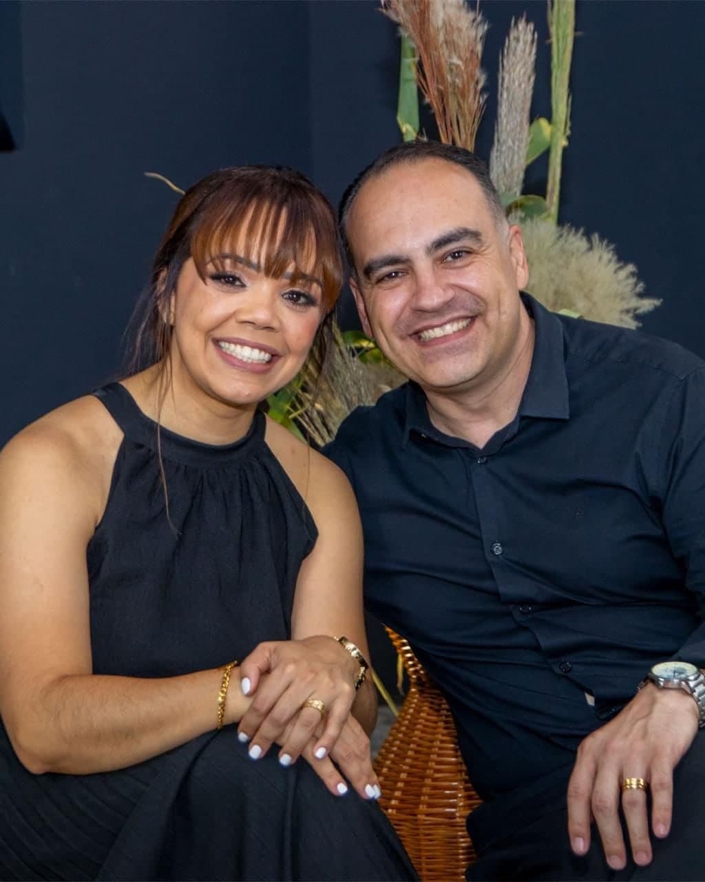 Pastors Claudinei and Marielsy sitting side by side, smiling